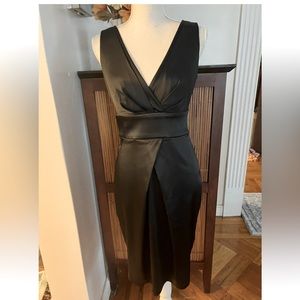 Size 4 Calvin Klein Black V-neck ,sleeves less.